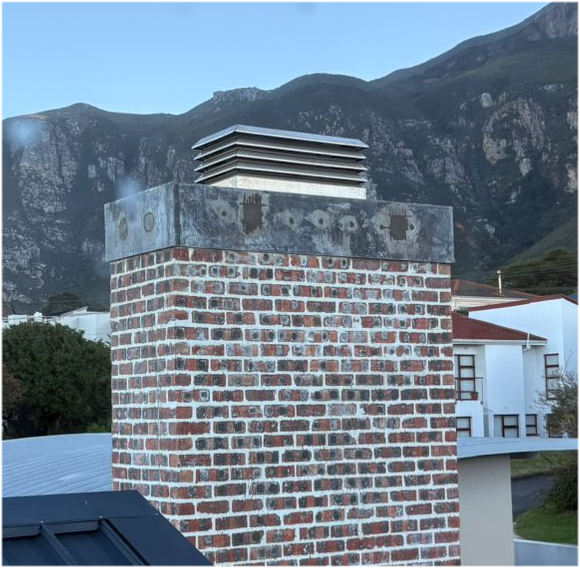 1000 x 500 Stainless steel Turbo Cowl Installed on a brick chimney
